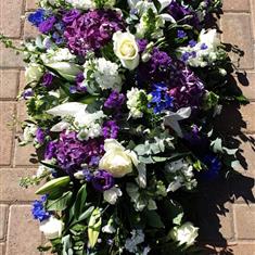 Purples and white coffin spray